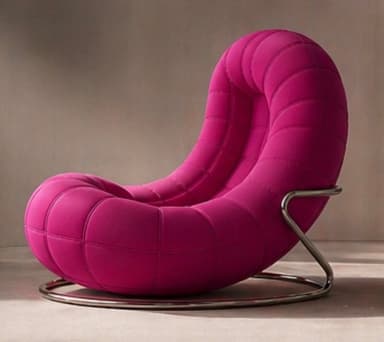 A modern armchair with a rounded, upholstered seat and backrest, featuring a quilted pattern. It is supported by a minimalist metal base. — 3D model