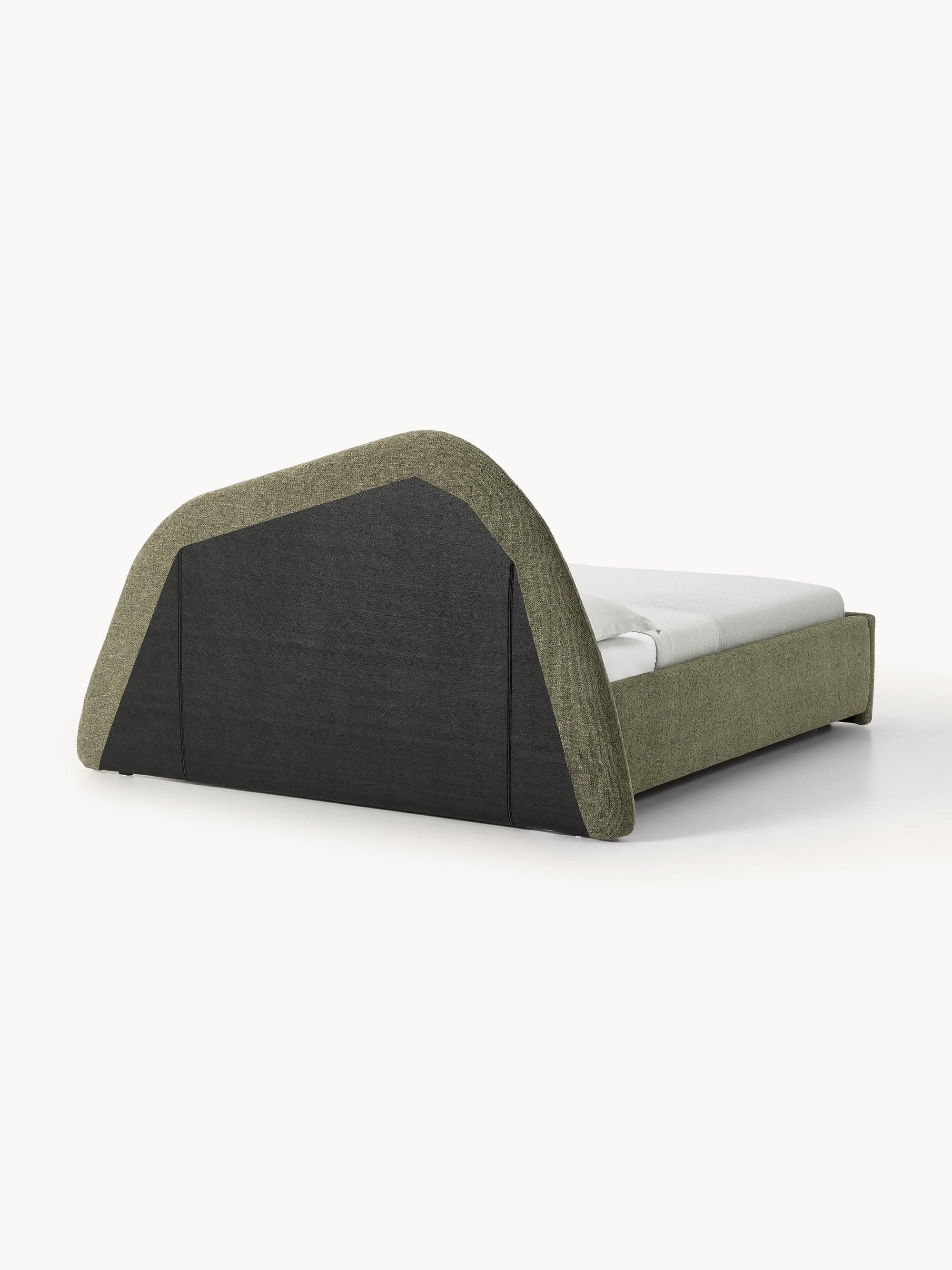 This is an image of a modern upholstered platform bed featuring a distinctive, large, and sculptural curved headboard. The bed frame and headboard are entirely covered in a textured, muted green/khaki fabric. The headboard curves upwards and then gently back, creating a visually interesting silhouette. The rear of the headboard appears to be finished in a darker, contrasting fabric or material. A white mattress and simple white bedding are visible on the bed frame. — 3D model
