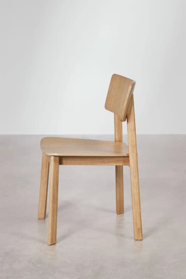 A modern, minimalist side chair constructed from light-colored solid wood, featuring a flat seat and a curved backrest attached to the rear legs. — 3D model
