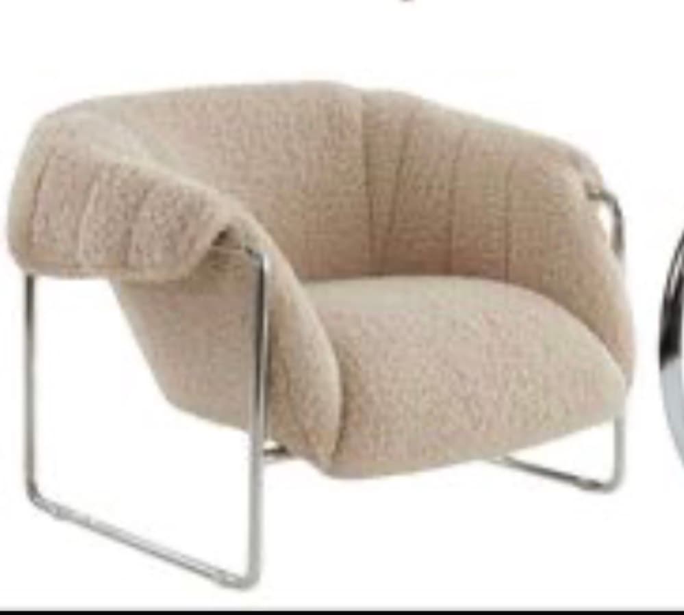 A contemporary lounge chair featuring a plush, light beige bouclé upholstery with channel tufting on the backrest, supported by a sleek tubular metal frame. — 3D model