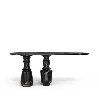 A sophisticated and sculptural console table crafted entirely from black marble with prominent white veining. It features an elongated oval tabletop supported by two distinct, heavily carved baluster-style pedestals, giving it a strong, classical yet contemporary presence. — 3D model