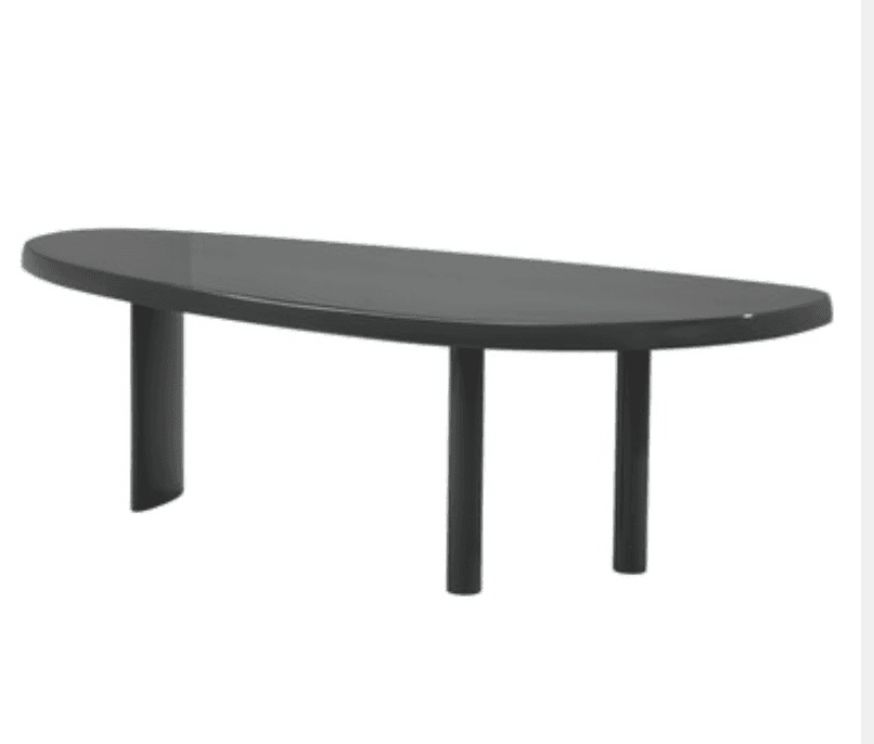 An elongated, organically shaped coffee table with a matte dark gray finish. The tabletop features soft, rounded edges, and it is supported by an asymmetrical leg design: one wide, curved, panel-like leg at one end, and two slender, cylindrical legs at the other. — 3D model