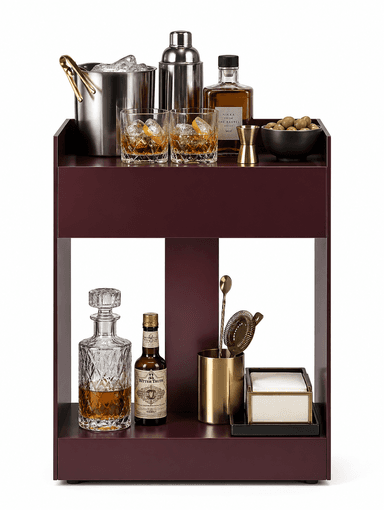 A contemporary side table crafted from metallic material, featuring a dark reddish-purple hue and a minimalist, geometric form. It consists of a top surface with a raised lip on three sides, a central open compartment, and a solid base. A small dark bowl rests on the top surface. — 3D model