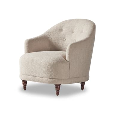 An upholstered barrel-back accent chair featuring a light-colored, textured boucle fabric, button tufting on the backrest, and four turned wooden legs. — 3D model