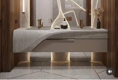 A double basin vanity unit with a speckled grey countertop, integrated sinks, and gold-toned faucets. The unit features a minimalist design with a beige drawer or cabinet section underneath the countertop and two block-like supports at either end. Soap dispensers and a bar of soap are placed on the countertop. — 3D model