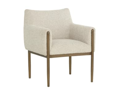 A contemporary armchair featuring a structured yet inviting design. It has a light-toned, textured boucle-like upholstery covering the seat, back, and armrests. The chair is supported by a slender metal frame with a warm, aged brass or bronze finish, which extends upwards to elegantly wrap around the outside of the upholstered armrests. The legs are straight and tapered, providing a clean, modern aesthetic. — 3D model
