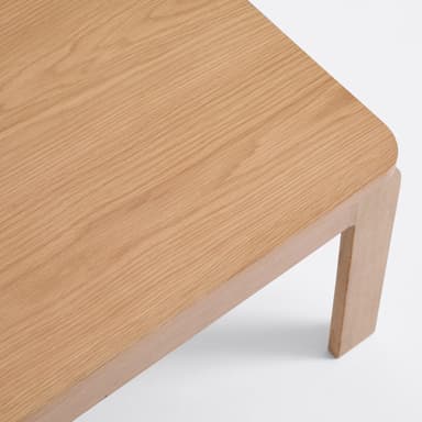 A rectangular coffee table with rounded corners and four straight legs. The table has a simple, minimalist design. — 3D model