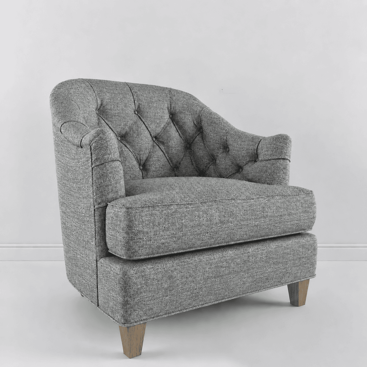 A button-tufted upholstered armchair featuring a textured grey fabric. The chair has a high, rounded backrest with diamond-pattern tufting, subtly rolled arms, and a thick, removable seat cushion. It stands on four short, splayed light-colored wooden legs. — 3D model