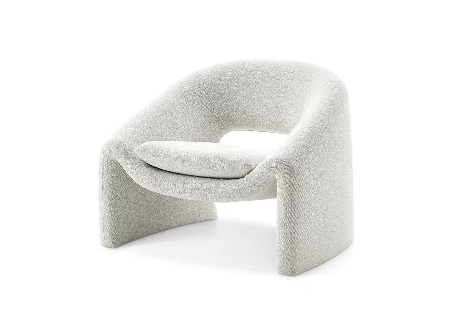 A modern armchair with a distinctive curved silhouette and plush upholstery. The chair features an open back and a scooped seat with an integrated cushion, supported by a continuous base that forms both legs and armrests. — 3D model