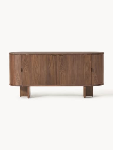 A mid-century modern inspired cabinet with a rounded, cylindrical body and a plinth base. It features two vertically oriented doors with concealed handles and a curved top surface. The material appears to be solid wood with a prominent grain pattern. — 3D model
