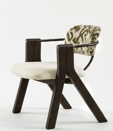 A contemporary armchair featuring a dark brown wooden frame, a cream upholstered seat cushion, and a distinctive curved backrest with a green and white zebra-like pattern. The arms are integrated into the solid wooden structure, and a black metal rod supports the patterned backrest. — 3D model