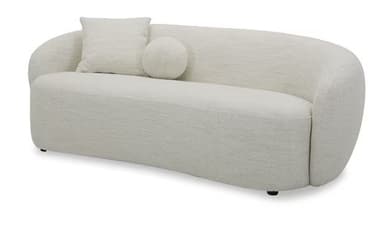 A contemporary, fully upholstered sofa featuring a distinct curved profile, covered in a textured bouclé fabric. It has a low-profile design with a continuous backrest and armrests that gently slope downwards. The sofa is supported by small, discreet black feet and includes two matching throw pillows: one square and one round. — 3D model