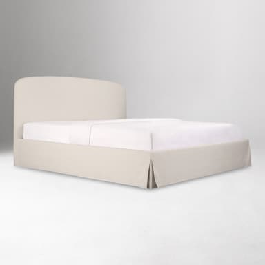 A modern platform bed with a gently curved, upholstered headboard and a rectangular, upholstered base. The bed is dressed in neutral-toned linens. Flanking the bed are two matching wooden nightstands with minimalist designs, featuring drawers and open shelving. — 3D model