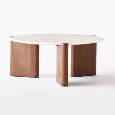 A close-up view of a coffee table section, highlighting its distinctive top and edge. The tabletop appears to be constructed from irregularly shaped pieces of translucent, white-to-off-white natural stone, possibly agate or quartz, which are irregularly pieced together. The material exhibits natural inclusions and variations in opacity, creating a unique, crystalline pattern. The edge of the tabletop is rounded. A portion of the table base is visible, featuring a dark brown, polished wood with a visible grain, likely walnut or a similar hardwood. The wood has a smooth, lustrous finish. — 3D model