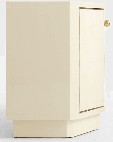 A long, low sideboard cabinet featuring a cream-colored lacquered finish and brass hardware. The facade is subtly segmented with four cabinet doors, each framed by brass trim. The cabinet sits on a recessed plinth base that follows the slight inward curve of the segmented front, giving it a distinctive postmodern appearance. — 3D model