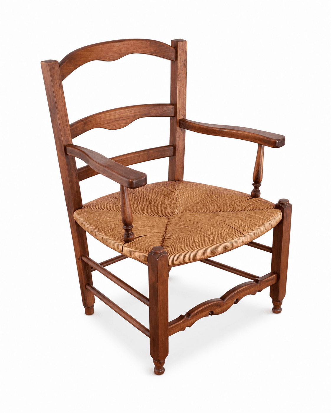 A rustic wooden armchair featuring a dark-stained solid wood frame and a tightly woven natural rush seat. The backrest is a ladder-back style with a shaped crest rail and two horizontal slats. The armrests are flat and slightly curved, supported by turned stiles. The front legs are turned, while the rear legs are straight, all connected by H-stretchers. A distinctive scalloped apron adorns the front stretcher between the legs. — 3D model