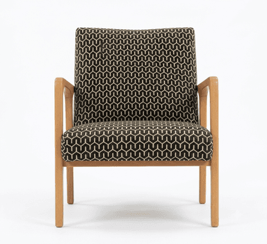An armchair featuring a light wood frame with exposed armrests and legs, and a backrest upholstered in a black and tan geometric patterned fabric. The image shows the chair from the rear. — 3D model