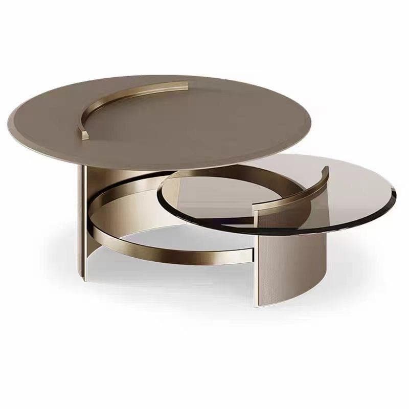 A sophisticated modern two-tiered round coffee table featuring a larger upper tier with an opaque brown glass top and a smaller, lower tier with a clear or smoked glass top. The table is supported by a sculptural base made from polished, curved metallic bands, likely brass or bronze, that provide both stability and a distinctive aesthetic. A decorative, crescent-shaped metal accent is visible on both glass surfaces. — 3D model