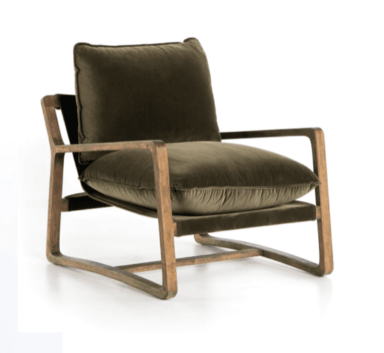 A modern lounge armchair featuring a distinct open wooden frame with a sled base, upholstered with plush, dark olive green velvet cushions. The frame exhibits a natural, somewhat rustic wood grain. The chair has wide, box-style armrests and two loose cushions for the seat and back, providing a comfortable and contemporary aesthetic. — 3D model