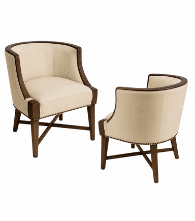 A cream-colored armchair with a curved back and wooden frame. The frame is dark brown and appears to be made of solid wood, with curved arms that transition into the backrest. The upholstery is a neutral cream fabric, tufted or gathered around the seat and back. Decorative nailhead trim runs along the base of the seat and the outer edges of the arms. The legs are dark brown wood, tapering slightly, with an X-shaped stretcher connecting the front legs. — 3D model