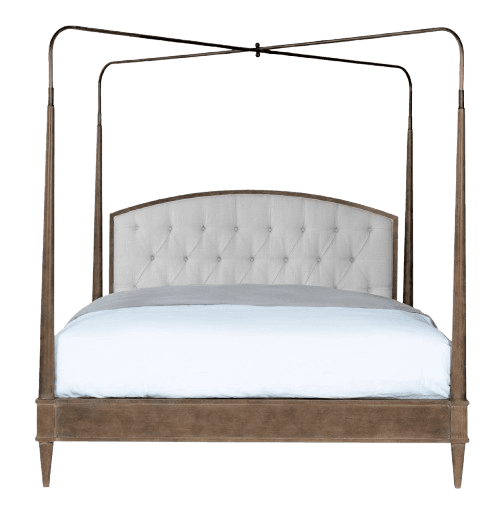 A canopy bed featuring a wooden frame with four tall posts supporting a metal canopy structure. The headboard is upholstered with tufted, light-colored fabric and has a curved top. The bed frame is a neutral wood tone, and the posts are cylindrical with a slightly tapered base. — 3D model