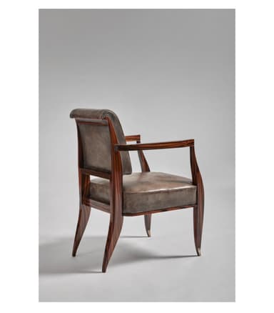 A sophisticated armchair featuring an exposed dark brown wood frame and rich grey-brown leather upholstery. The chair has subtly curved armrests and tapered legs, with polished metallic caps on the feet, adding a touch of elegance. The seat and backrest are well-padded, providing comfort, while the visible wood grain enhances its natural appeal. The design blends classic elements with a transitional aesthetic, suitable for various interior styles. — 3D model