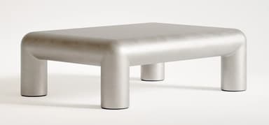 A contemporary coffee table with a monolithic design. It features a rectangular top with rounded edges that seamlessly transitions into four cylindrical legs. The overall form is smooth and sculptural, suggesting a modern aesthetic. — 3D model