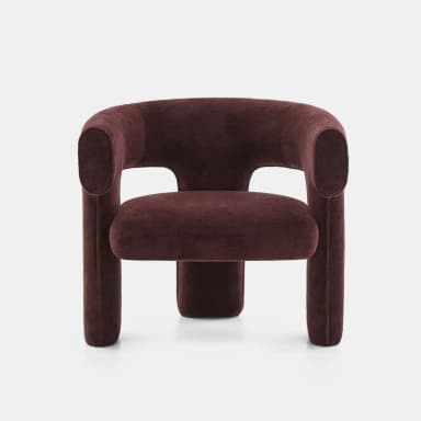 A modern, upholstered lounge chair featuring a distinctive sculptural and curvilinear form. The backrest and armrests are seamlessly integrated into a continuous, enveloping shape, upholstered in a deep reddish-brown, textured fabric. It stands on thick, rounded, integrated legs. — 3D model
