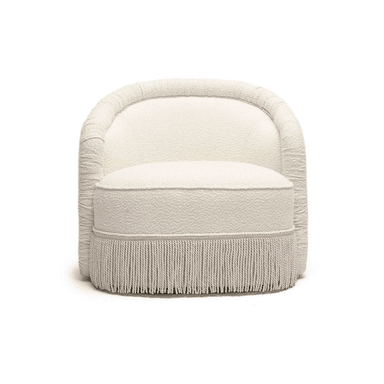 An upholstered barrel armchair featuring a continuous, curved backrest and integrated arms. The chair is covered in a cream-colored, textured fabric, likely boucle, and has a distinctive fringe skirt around its base. It includes a separate, rounded seat cushion. — 3D model