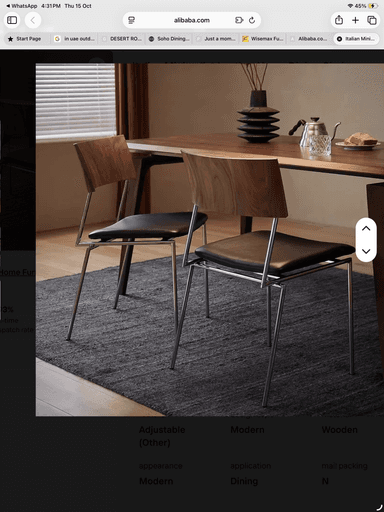 A contemporary dining chair featuring an armless design. It has a curved, dark wood (likely walnut plywood) backrest, a black upholstered seat, and a sleek four-legged frame made of chrome-plated metal. — 3D model