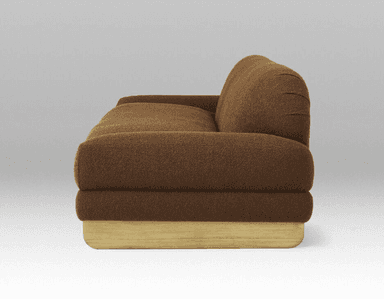 A medium-sized sofa viewed from the back. It features a curved backrest that seamlessly transitions into the armrests. The upholstery appears to be a textured fabric. The sofa is supported by short, angled legs. — 3D model