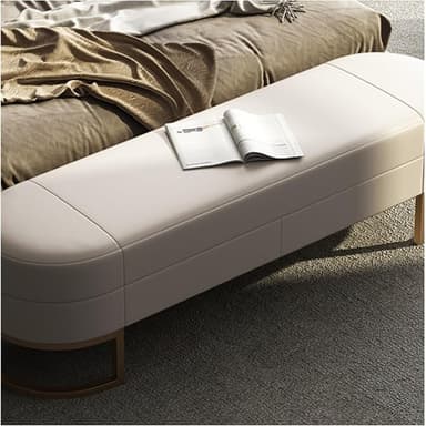 A contemporary upholstered bench featuring an off-white cushioned top with rounded ends and supported by two golden, semi-circular metal bases. — 3D model