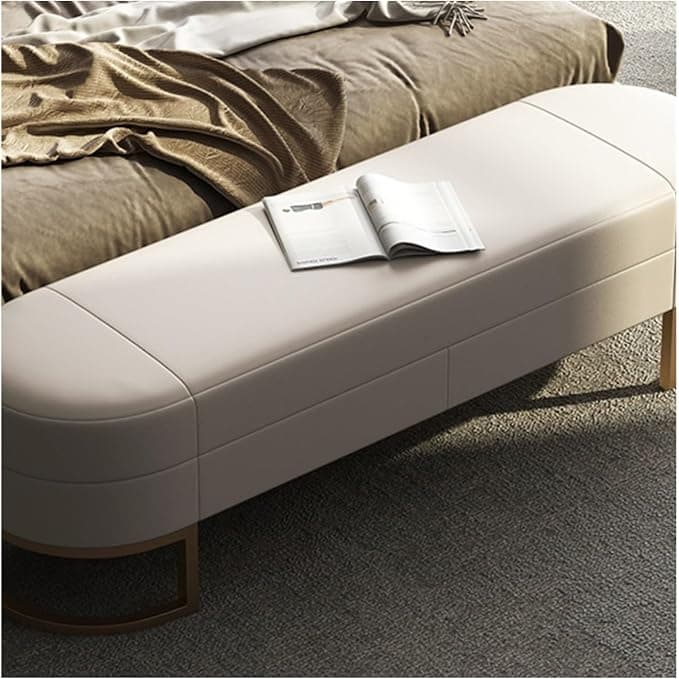 A contemporary upholstered bench featuring an off-white cushioned top with rounded ends and supported by two golden, semi-circular metal bases. — 3D model