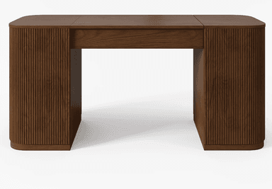 A contemporary desk constructed from dark brown wood, featuring vertical fluted detailing on the side panels and rounded corners. It has a single, integrated drawer or pull-out compartment positioned centrally beneath the tabletop, offering discreet storage. The desk stands on a recessed, plinth-style base that mirrors the rounded shape of the top. — 3D model