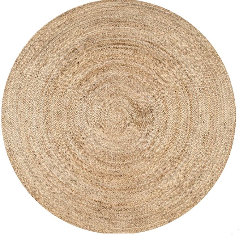 A circular rug made of woven natural fibers, exhibiting a concentric spiral pattern. The texture is coarse, with visible individual strands. — 3D model