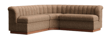 A beige L-shaped sectional sofa featuring vertical channel tufting on its backrest and arms, supported by a continuous, dark wood plinth base. The sofa is composed of modular sections, including a chaise element on the left side. — 3D model