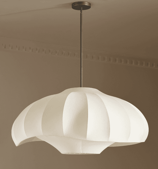 An off-white sculptural pendant light with an organic, undulating form, suspended by a dark metal rod and canopy. The shade appears to be made from a translucent, fabric-like material stretched over a frame, creating a ribbed or pleated texture. It is designed to provide diffused ambient lighting. — 3D model