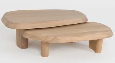 A set of two nesting coffee tables with organic, rounded rectangular tops. The tables are constructed from wood and feature thick, sculpted edges on the tabletops. They are supported by rounded cylindrical legs, with the smaller table fitting partially underneath the larger one. The design exhibits a minimalist and sculptural aesthetic. — 3D model