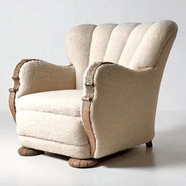 A cream-colored boucle armchair featuring a distinctive channeled backrest and carved wooden armrest supports and feet. The chair has a rounded, plush form, indicative of an Art Deco or Art Moderne aesthetic. The upholstery is a textured, off-white fabric, and the wooden elements display a light natural finish with intricate, leaf-like carvings. — 3D model