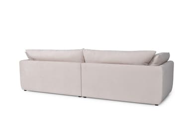 A modern, low-profile sofa with a modular design, featuring two seat cushions and plush back cushions. The sofa has rounded edges and appears to be upholstered in a light-colored fabric. It is presented on a black background. — 3D model