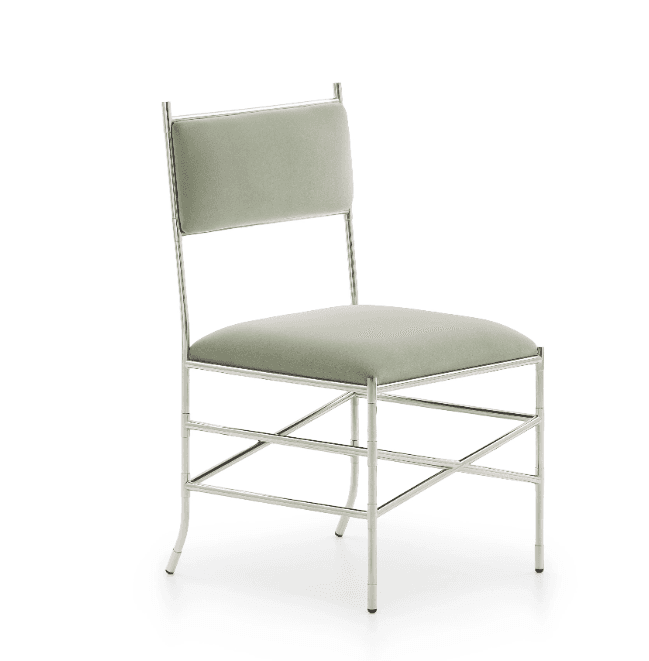 A contemporary side chair featuring a polished metal frame and upholstered seat and back. The frame is slender and appears to have decorative, possibly bamboo-inspired, joint detailing. The seat and backrest are upholstered in a light sage green fabric. The chair includes X-shaped stretchers for stability. — 3D model