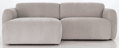 A sofa viewed from the back, featuring a neutral-toned fabric upholstery. The sofa appears to have a modern design with rounded armrests visible on the sides. The back is divided into two distinct cushioned sections, separated by a vertical seam. Small, dark-colored feet are visible at the base. A small, light-colored tag with an emblem is attached to the lower corner of the right side. — 3D model