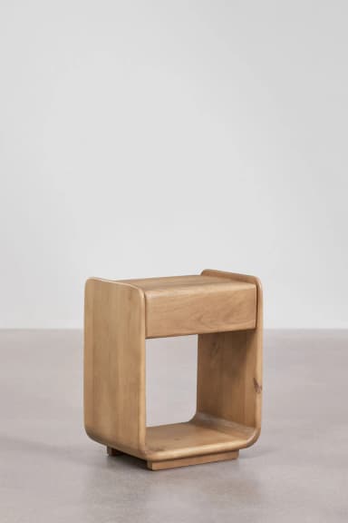 A modern, cube-shaped nightstand with rounded edges and an open compartment. The piece is constructed from solid wood and exhibits a natural grain pattern. It rests on a small, subtle base. — 3D model