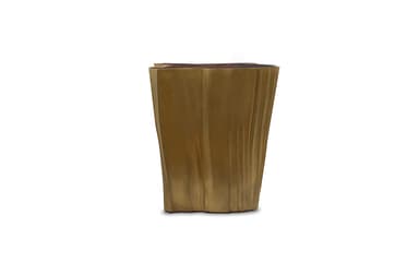 A unique side table with an irregular, organic-shaped top surface. The base is sculpted with vertical, flowing lines that give it a textured, almost liquid appearance. The overall form evokes a natural element, possibly inspired by tree trunks or rock formations. The top has a darker, mottled texture contrasting with the metallic base. — 3D model
