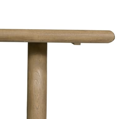 A low rectangular coffee table with a thick, rounded top and two sturdy, cylindrical legs positioned towards the ends of the table. The piece has a minimalist design and appears to be made from solid wood. — 3D model