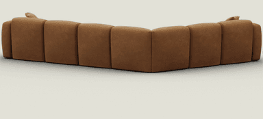 An L-shaped, modular sectional sofa upholstered in a warm camel brown microsuede-like fabric. The sofa features a soft, rounded profile with plush, integrated seat and back cushions. It consists of multiple segments, including corner and armrest pieces, creating a cohesive, inviting seating arrangement. The design is low-slung and minimalist, emphasizing comfort. — 3D model