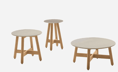 A small round table with a light grey top and three splayed natural wood legs connected by cross-braces. — 3D model