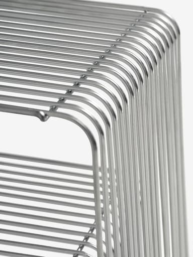 A modern chair constructed from bent metal rods. It features a minimalist design with parallel rods forming the seat and backrest, supported by a U-shaped frame. The legs also consist of bent metal rods, with a coiled design at the base. — 3D model