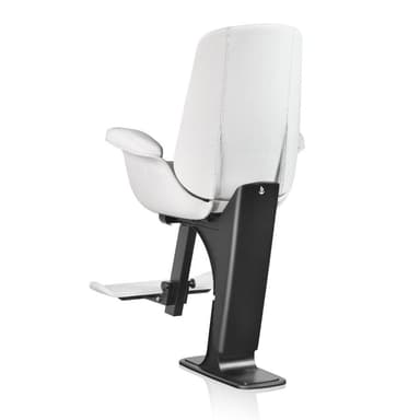 A modern professional barber chair featuring white upholstered seating surfaces, padded armrests, and an integrated footrest, all supported by a robust black pedestal base. — 3D model
