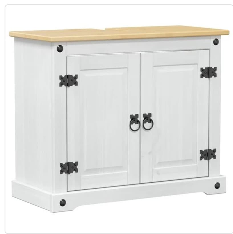 A white vanity unit with a light wood top. It features two cabinet doors with decorative black metal hinges and ring handles. The cabinet has a plinth base and decorative black metal studs on the corners. — 3D model